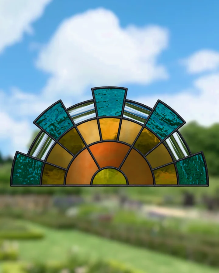 Art Deco fan suncatcher glazed, lit from behind.