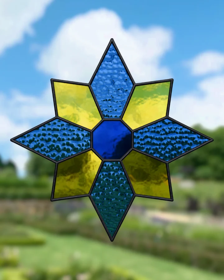 Eight-point star suncatcher glazed, lit from behind.
