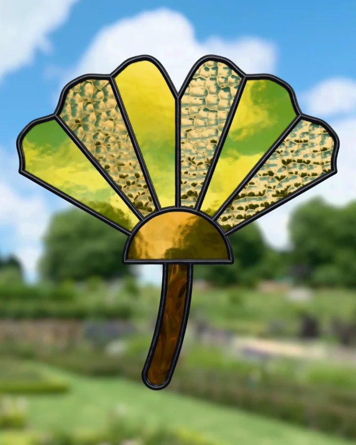 Ginkgo leaf suncatcher glazed, lit from behind.