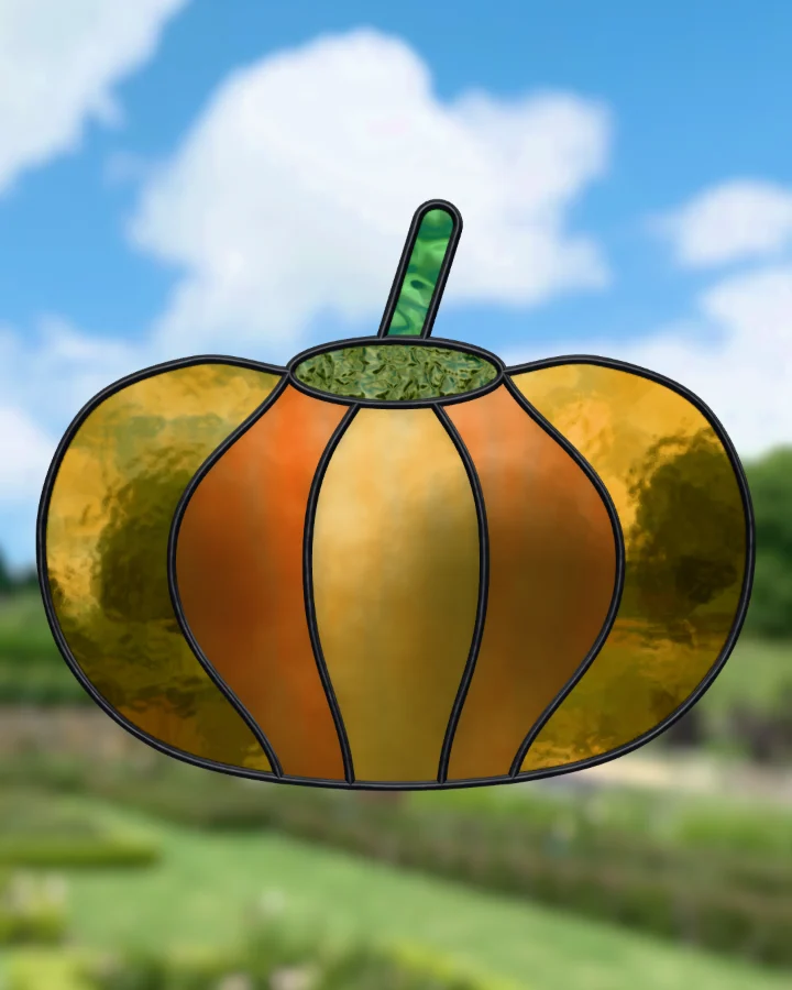 Pumpkin suncatcher glazed, lit from behind.