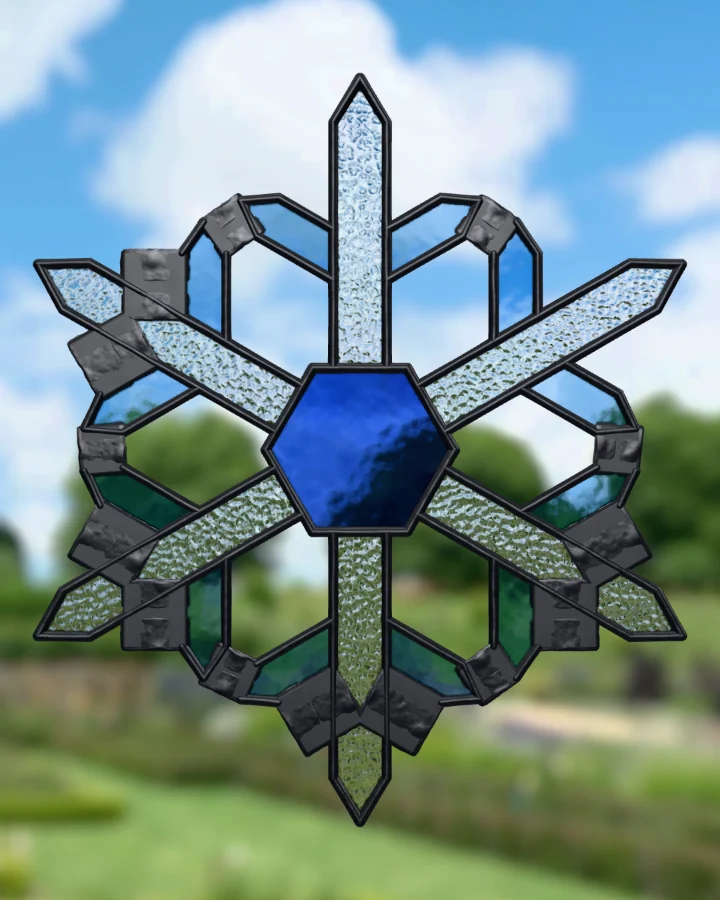 Snowflake suncatcher glazed, lit from behind.